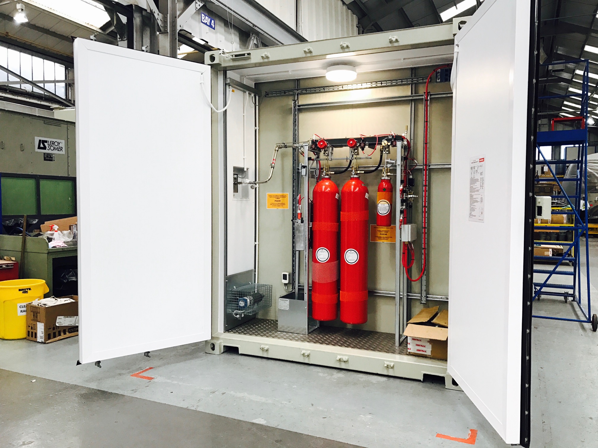 Red gas canisters behind doors