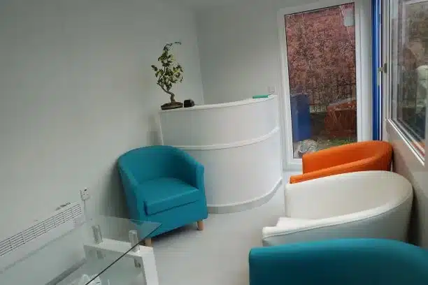 Container reception area with desk and chairs